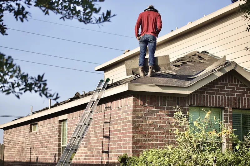 Professional roofer working on a residential roof in San Pablo